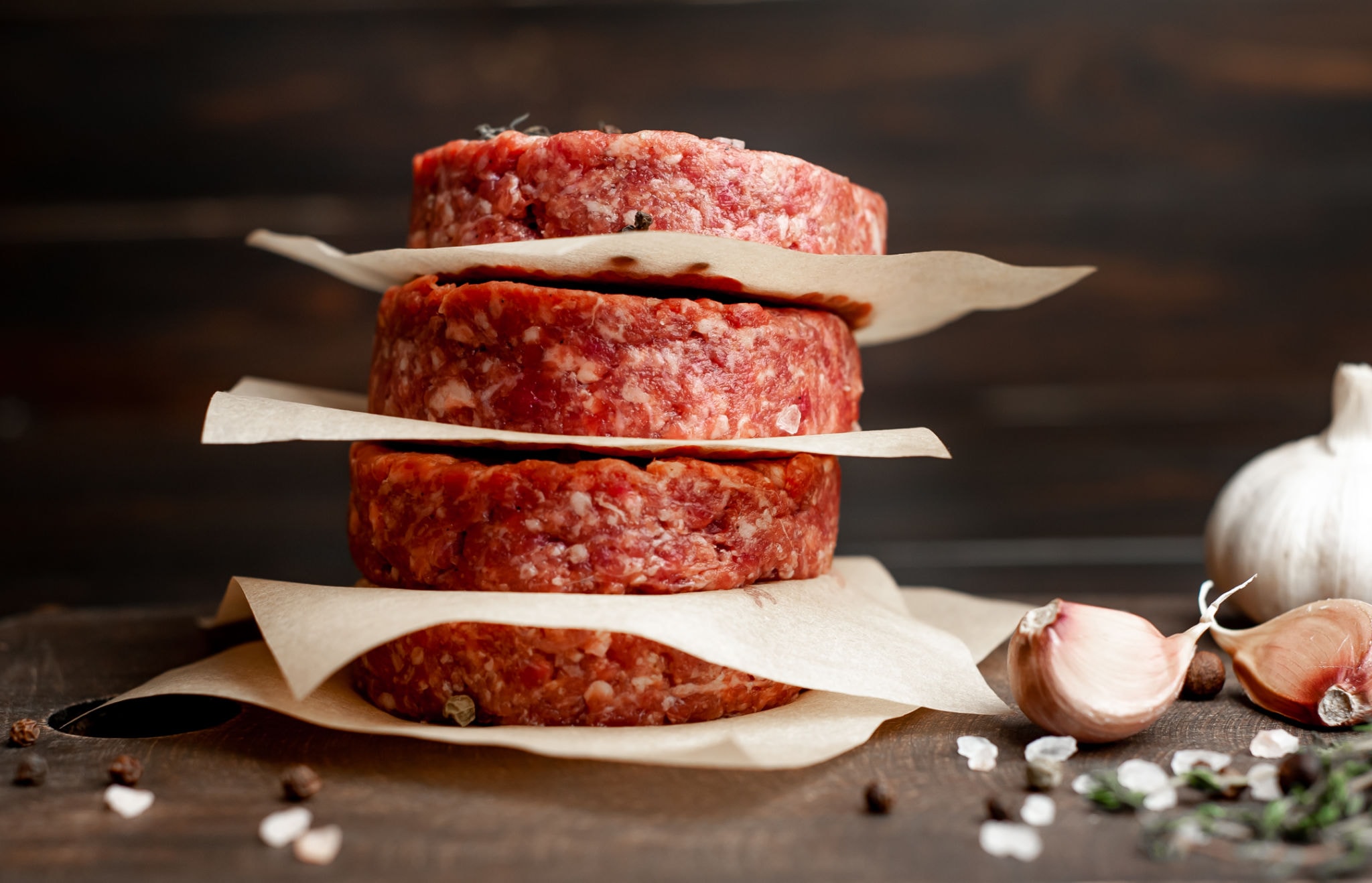 Stacked raw premium beef burger patties