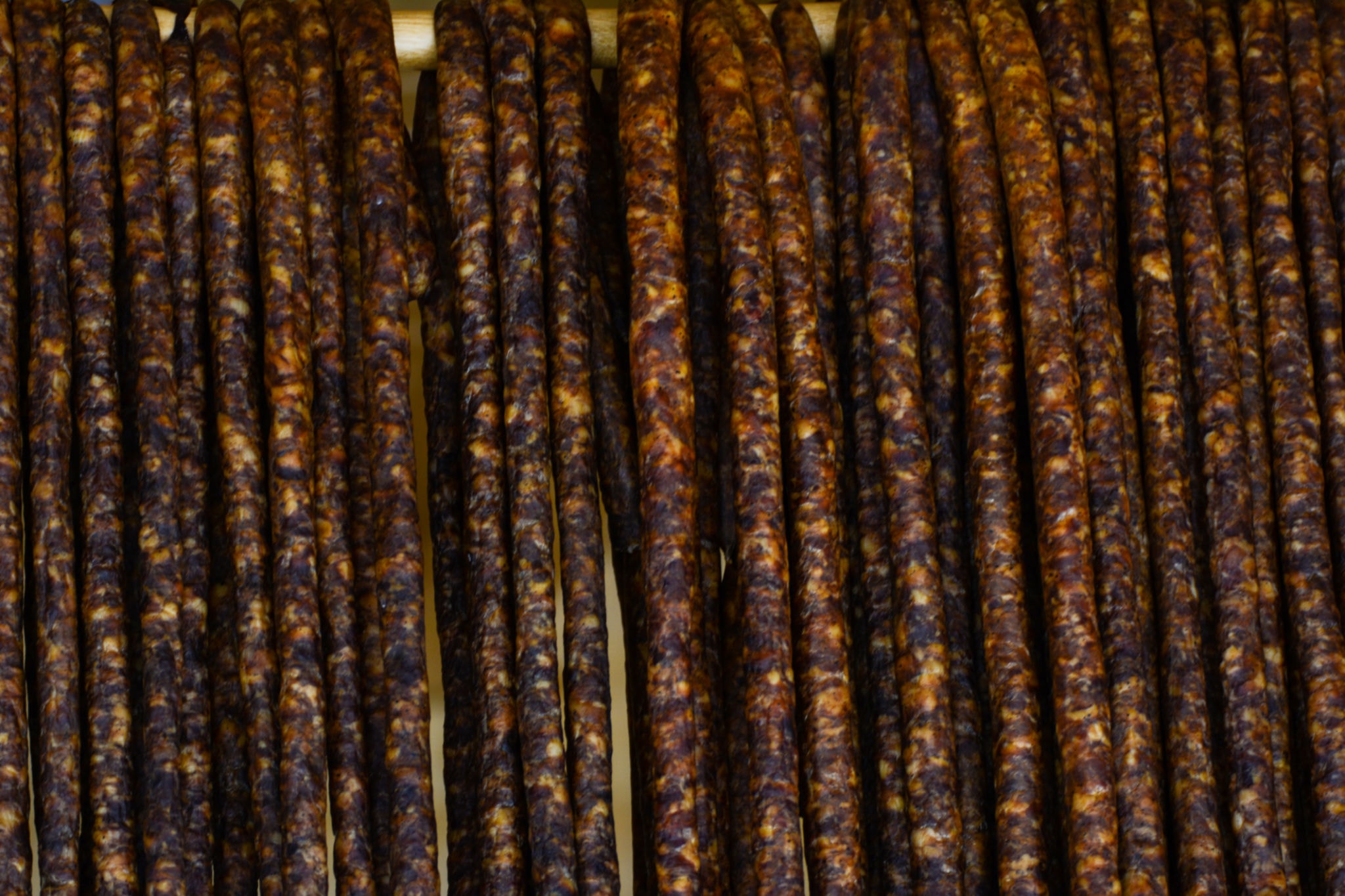 Rows of traditionally dried droëwors sausage